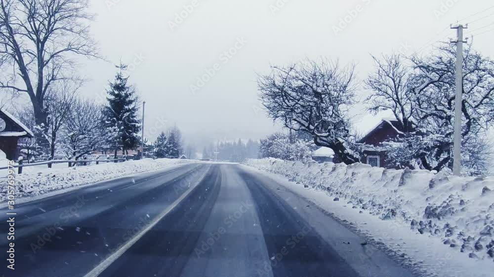 driving through the mountain town in snow storm driving through the mountain town in snow storm