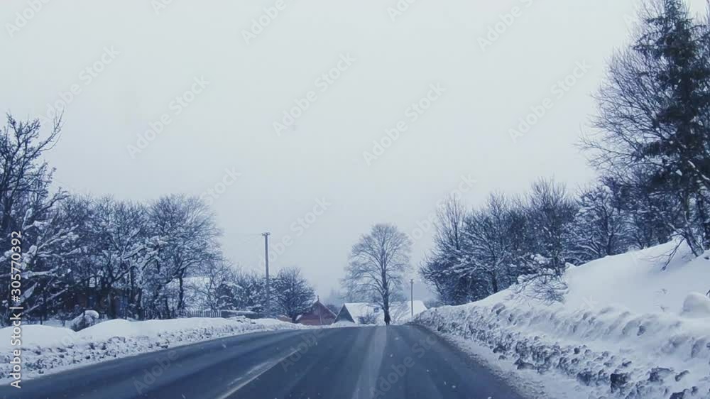 driving through the mountain town in snow storm driving through the mountain town in snow storm