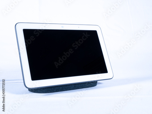 Touch screen smart home voice assistant speaker with blank screen on white background