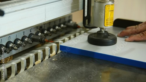 Close-up drilling machine, furniture production, drilling holes in furniture blanks close-up
