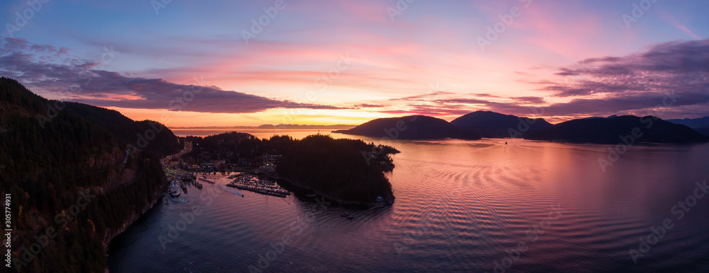Horseshoe Bay, West Vancouver, British Columbia, Canada. Aerial panoramic view of Ferry Terminal and Marina during a colorful and sunny sunset in Fall Season.
