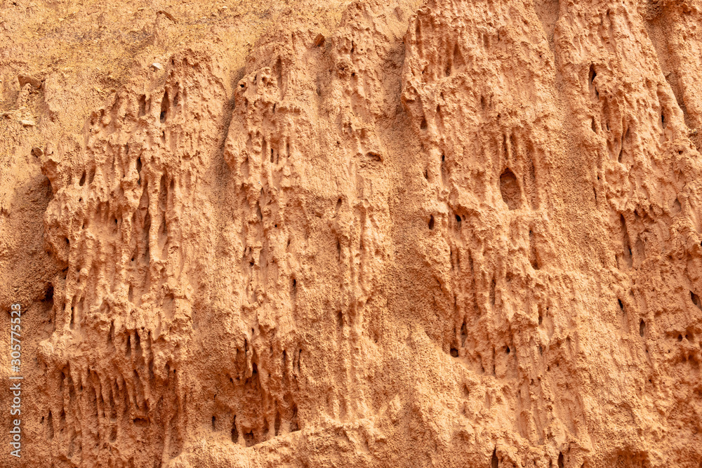 Red mountainside on hot day. Texture on wall of sandy canyon. Lack of water, drought from climate change Red mountainside on hot day. Texture on wall of sandy canyon. Lack of water, drought from climate change
