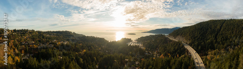 Horseshoe Bay  West Vancouver  British Columbia  Canada. Aerial view of residential homes near the Highway during a bright and sunny sunset in Fall Season.