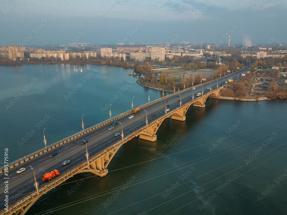 Aerial autumn Voronezh cityscape from drone flight height. View of the Vogresovsky bridge over Voronezh Water Reservoir Aerial autumn Voronezh cityscape from drone flight height. View of the Vogresovsky bridge over Voronezh Water Reservoir