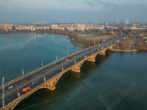 Aerial autumn Voronezh cityscape from drone flight height. View of the Vogresovsky bridge over Voronezh Water Reservoir