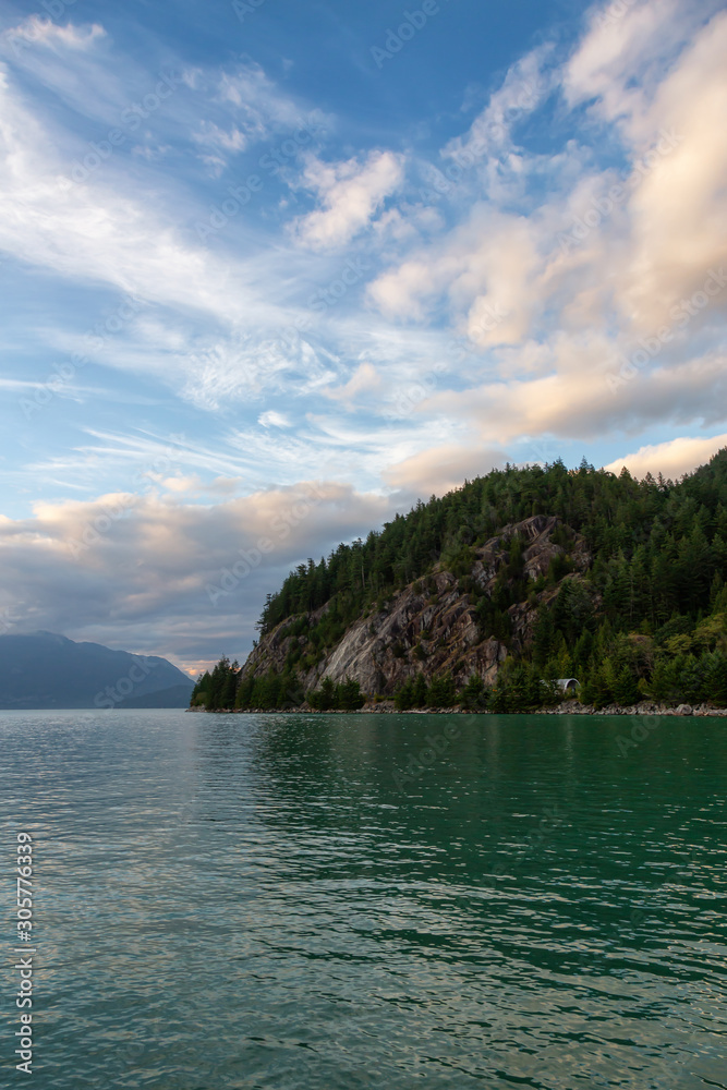 Beautiful View of Howe Sound surrounded by Canadian Mountain Landscape during summer sunset. Taken in Porteau Cove, North of Vancouver, BC, Canada.