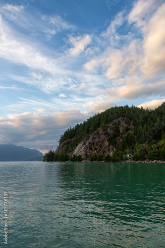 Beautiful View of Howe Sound surrounded by Canadian Mountain Landscape during summer sunset. Taken in Porteau Cove, North of Vancouver, BC, Canada.