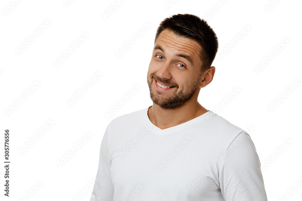 Close-up portrait of smiling handsome bearded man in white shirt looking at camera isolated on white background