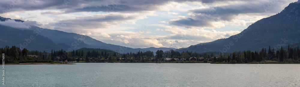Panoramic View of Residential Homes near Green Lake during a cloudy summer sunset. Taken in Whistler, British Columbia, Canada.