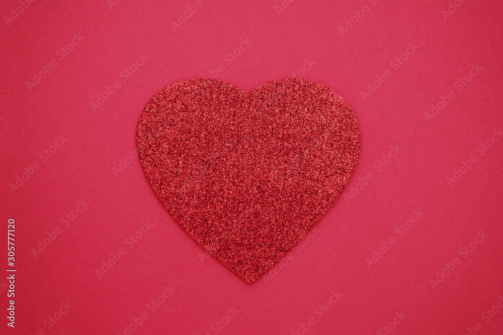 Love, Valentine's Day red background with glitter red heart. Flat lay.