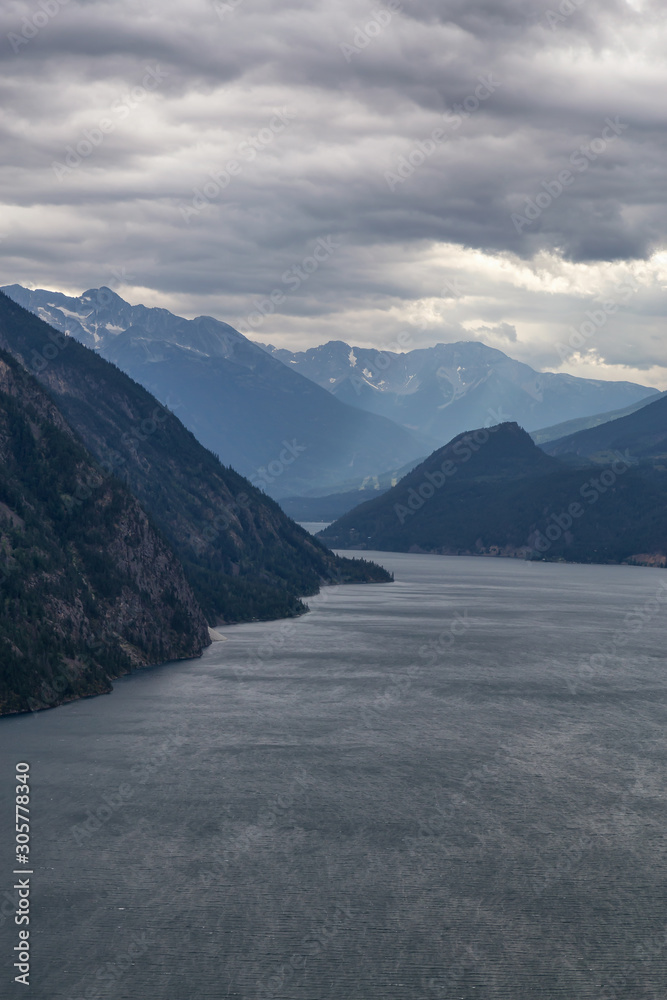 Aerial View of Anderson Lake surrounded by Canadian Mountain Landscape during a cloudy summer day. Located near Lillooet, BC, Canada.