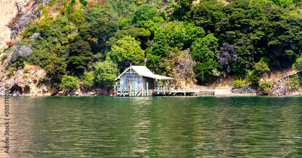 Small, old boathouse with jetty on the South Island of New Zealand Small, old boathouse with jetty on the South Island of New Zealand