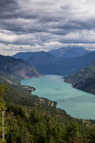 Beautiful View from Above of Seton Lake surrounded by Canadian Mountain Landscape during a summer day. Taken in Shalalth near Lillooet  BC  Canada.