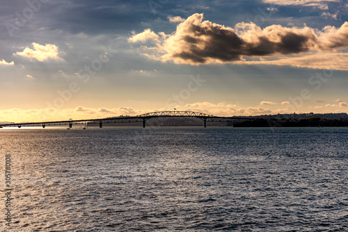 Evening atmosphere in Devenport, with a view of the Harbor Bridge, Auckland, New Zealand photo