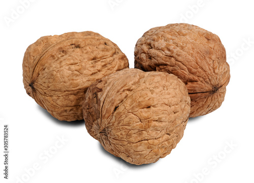 Close up of three hard walnut isolated on white background.