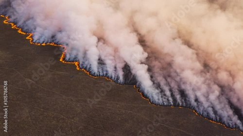 Wallpaper Mural Climate change.High aerial fly over view of a grass fire in the Okavango Delta, caused by drought and climate change, Botswana Torontodigital.ca