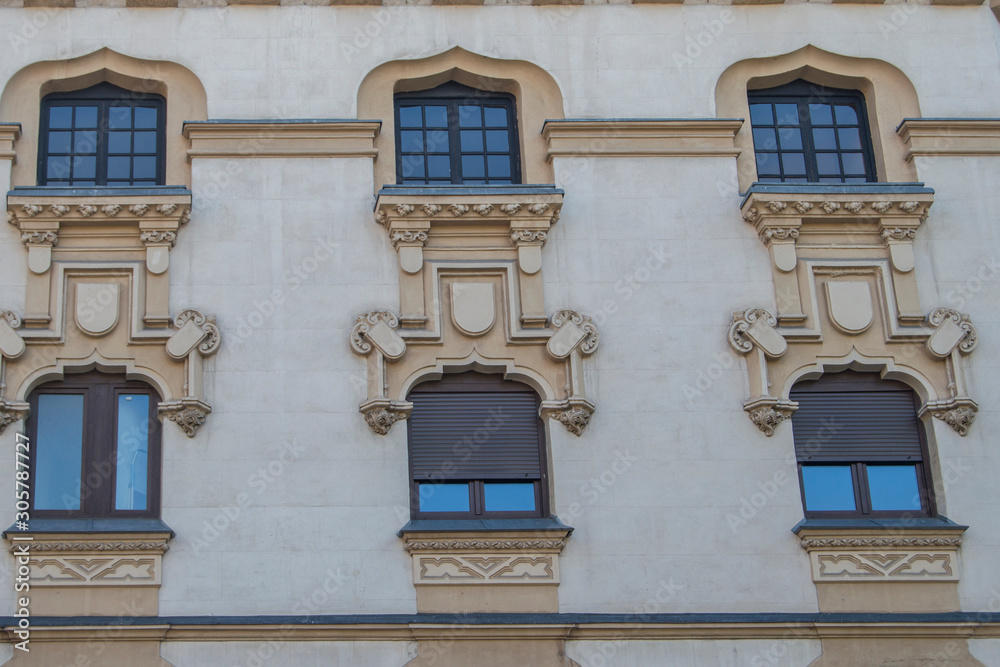facade of a convent with neo-gothic windows