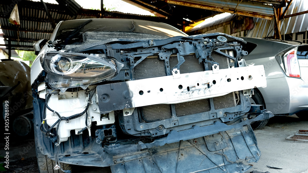 The old broken car in garage for waiting repair