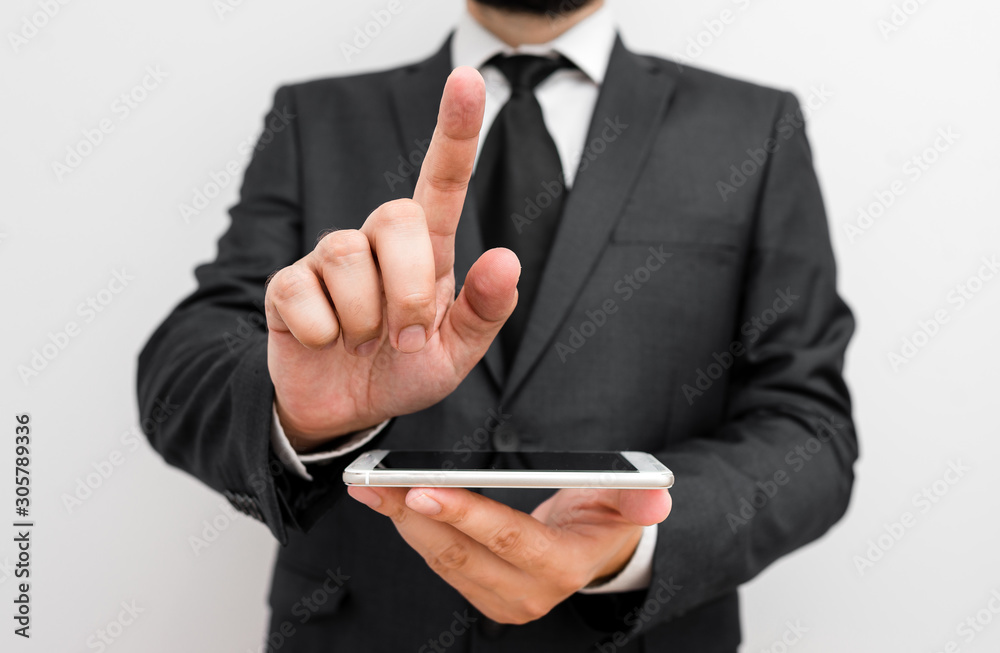 Male human wear formal work suit hold smart hi tech smartphone use one hand Male human wear formal work suit hold smart hi tech smartphone use one hand