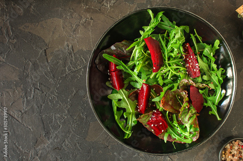 salad beetroot, leaf mix (beet, lettuce, arugula, red chard and more) menu concept. food background. top view. copy space