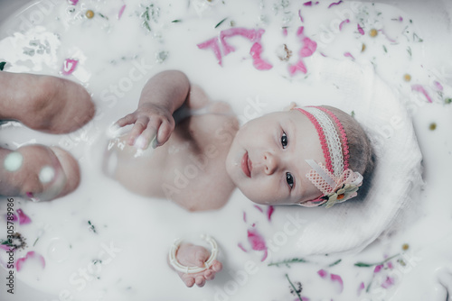 baby in milk with flowers