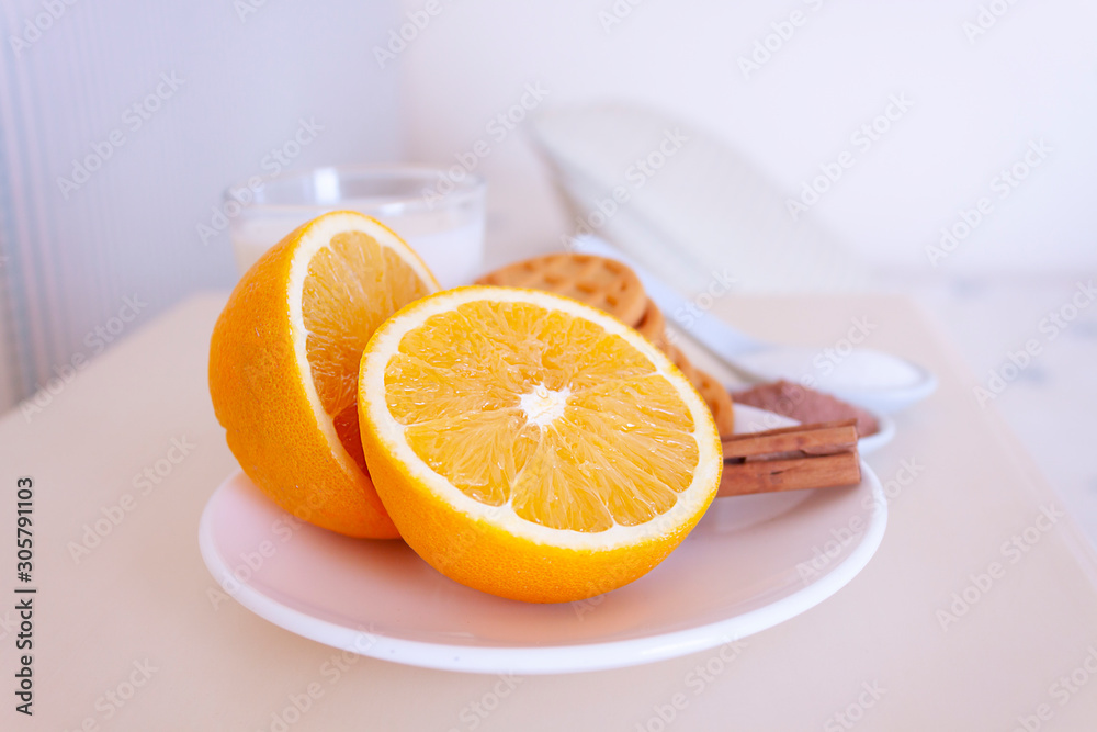 HEALTHY BREAKFAST WITH ORANGE, COOKIES, MILK, COCOA AND SUGAR NEXT TO ROOM BED HEALTHY BREAKFAST WITH ORANGE, COOKIES, MILK, COCOA AND SUGAR NEXT TO ROOM BED