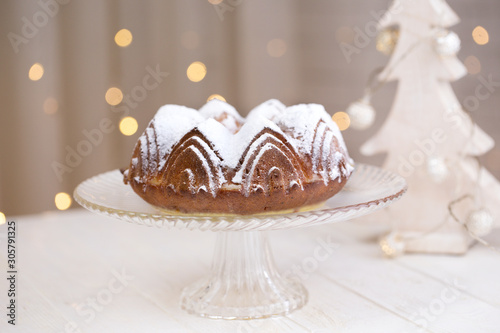 homemade cake with blurred lights background. cake with sugar powder.