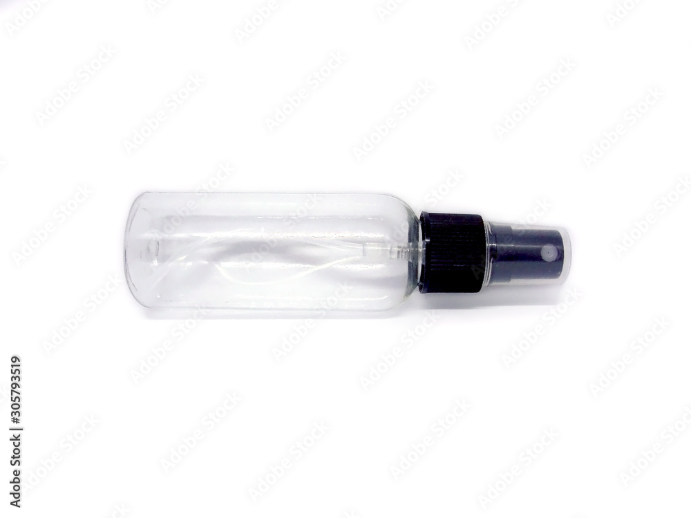 Clear, empty travel-sized spray bottle on a white background Clear, empty travel-sized spray bottle on a white background