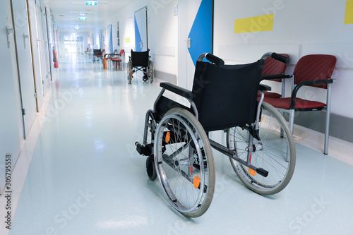 Wheelchair in the hospital hall. Hospital interior. Medical healthcare concept.