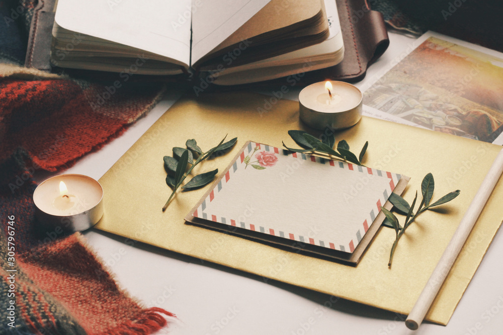 Opened book and leaves, postcard, autumn home comfort