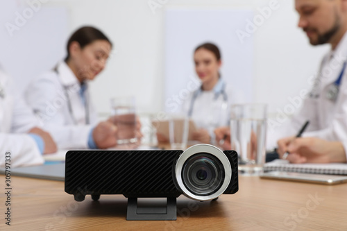 Video projector on table during medical conference