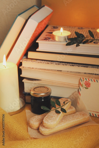 Books and candles, autumn home comfort and warm light
