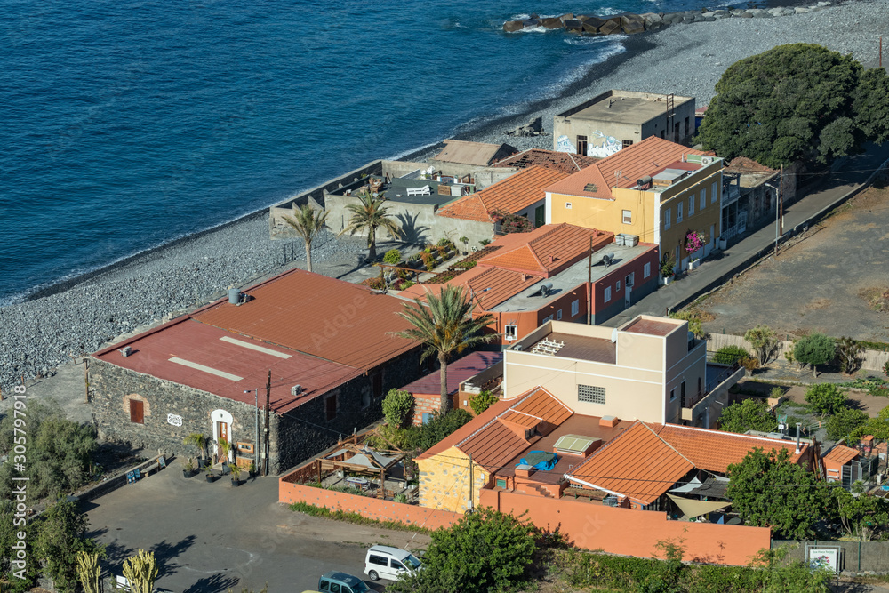 Early morning of quiet warm, sunny weather in the beach and harbor. Aerial view of Playa de Santiago. Panoramic, fisheye lens, wide angle. La Gomera, Canary Islands, Spain