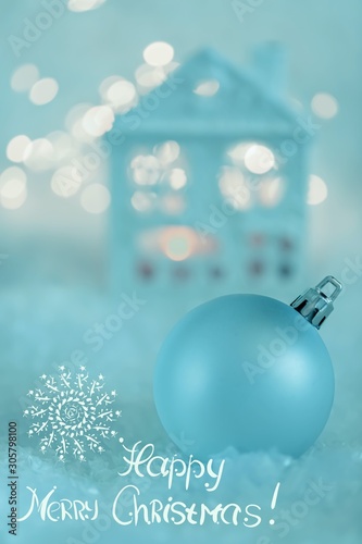 Greeting card Happy Merry Christmas. Blue Ball and Beautiful blurred background of winter decoration for the holiday. Soft focus