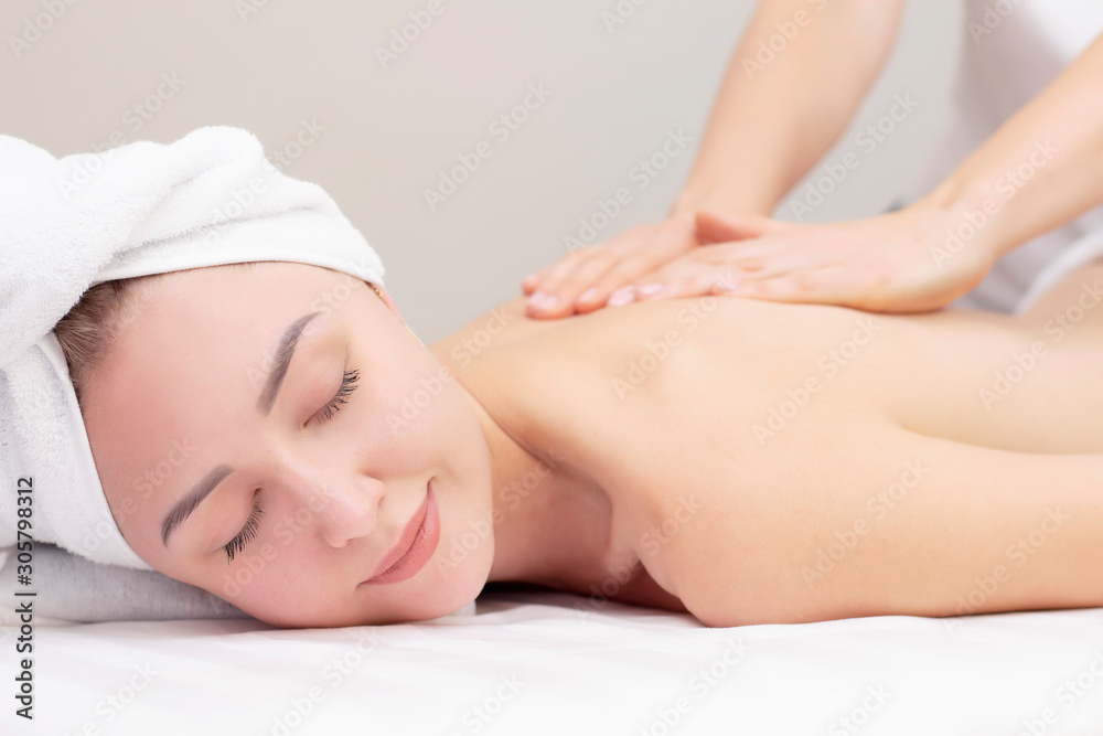 Massage and body care. Spa body massage woman hands treatment. Woman having massage in the spa salon for beautiful girl Massage and body care. Spa body massage woman hands treatment. Woman having massage in the spa salon for beautiful girl
