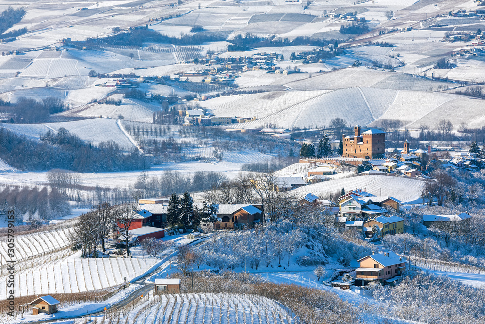 Hills and vineyards of Langhe covered in snow in Italy.