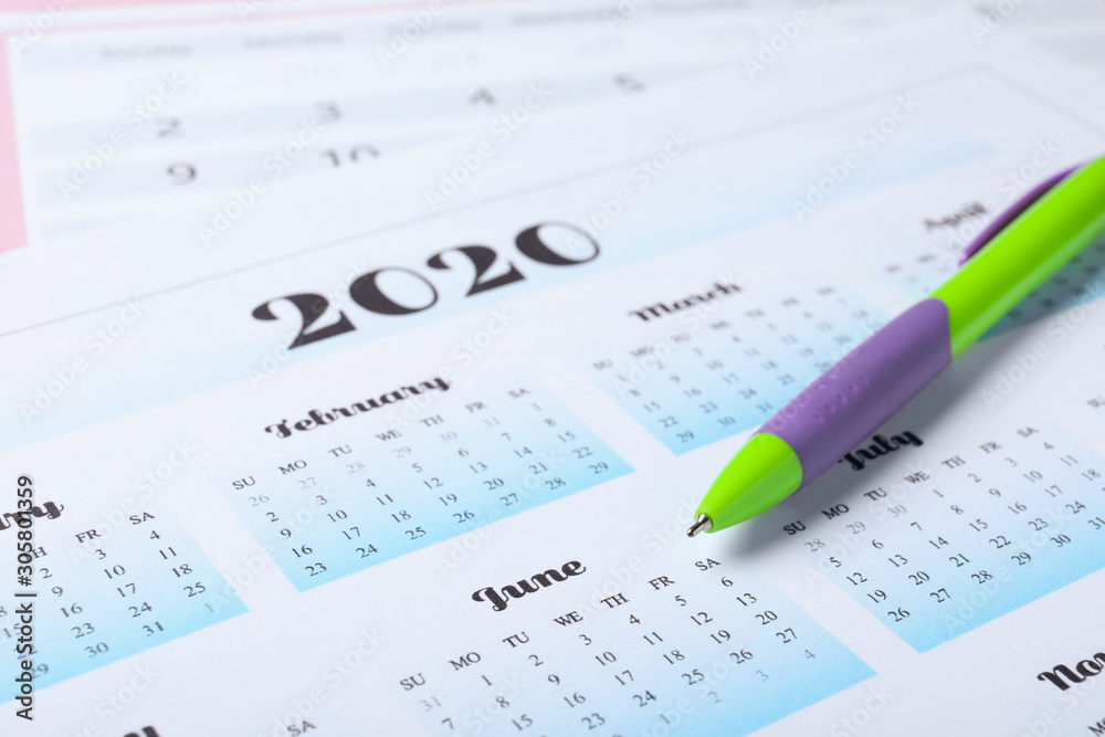 Pen on calendar page, closeup. Planning concept Pen on calendar page, closeup. Planning concept