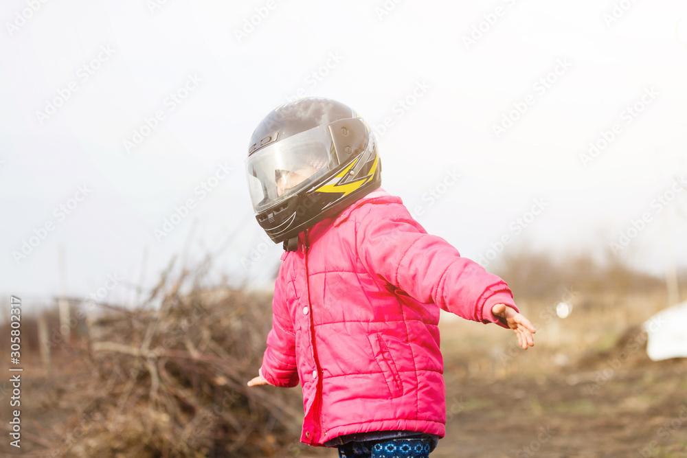 little girl in a motorcycle helmet Stock Photo Adobe Stock