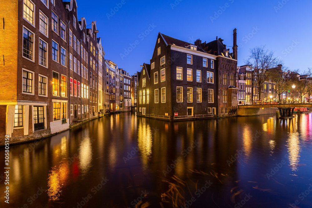 Red light district medival building at night. Amsterdam, Netherlands