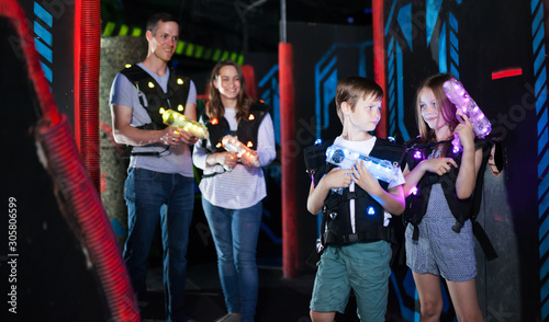 Boy and girl on lasertag arena