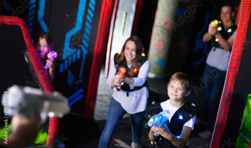 Kids with parents during lasertag game
