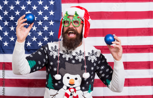 Celebrate today. American man celebrate winter holidays. Patriotic Santa on stars and stripes background. Celebrate Christmas and new year the american way. Seasons greetings. Keep calm and celebrate © be free