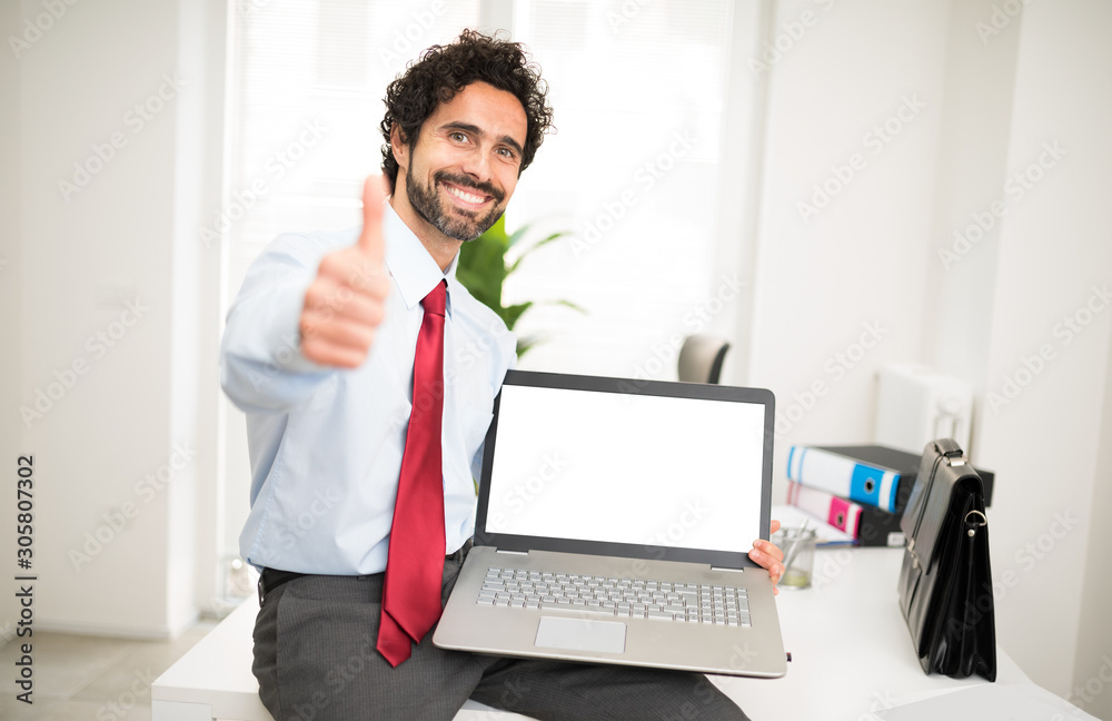 Businessman showing a laptop with a blank screen Businessman showing a laptop with a blank screen