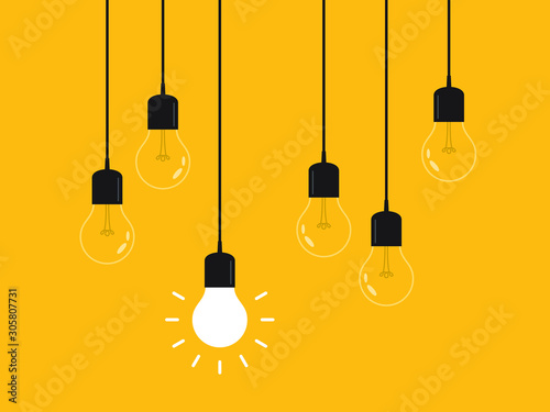 Set of hanging light bulbs with one glowing. Leadership, power and uniqueness concept.