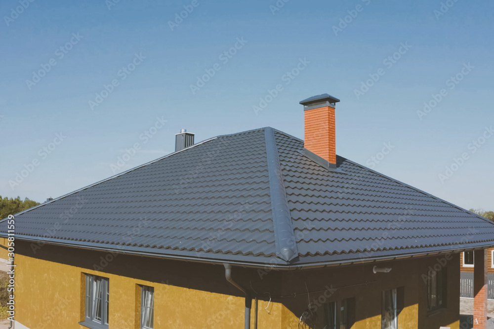 Corrugated metal roof and metal roofing. Modern roof made of met Corrugated metal roof and metal roofing. Modern roof made of met