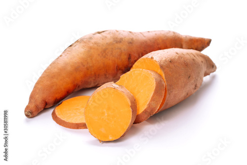 Sweet Potato Farmland Root Tuber and Sliced Pieces Cut Out. Organic Ripe Orange Batata Isolated on White Background Photo. Uncooked Botanical Yam for Baked, Fried or Boiled Tasty Dishes