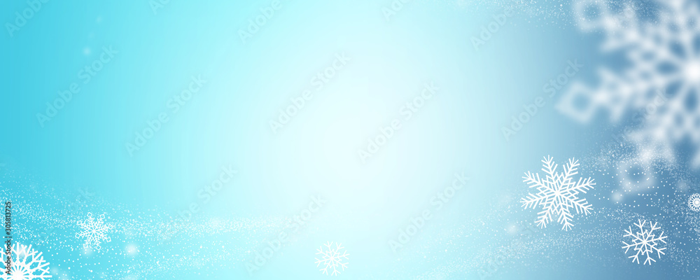 Winter background with white snowflakes and copy space.
