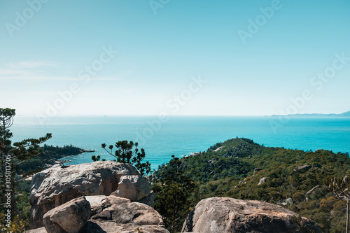 Pristine nature in Magnetic island, Australia, beautiful view on the ocean and green tropical forest below © Klara