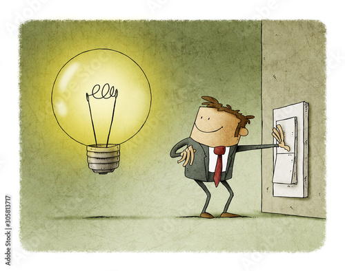 Businessman presses a switch and turns on a light bulb symbol of having an idea.