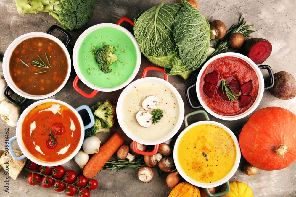 Variety of colorful vegetables cream soups and ingredients for soup. Concept of healthy eating or vegetarian food with mushrooms Variety of colorful vegetables cream soups and ingredients for soup. Concept of healthy eating or vegetarian food with mushrooms